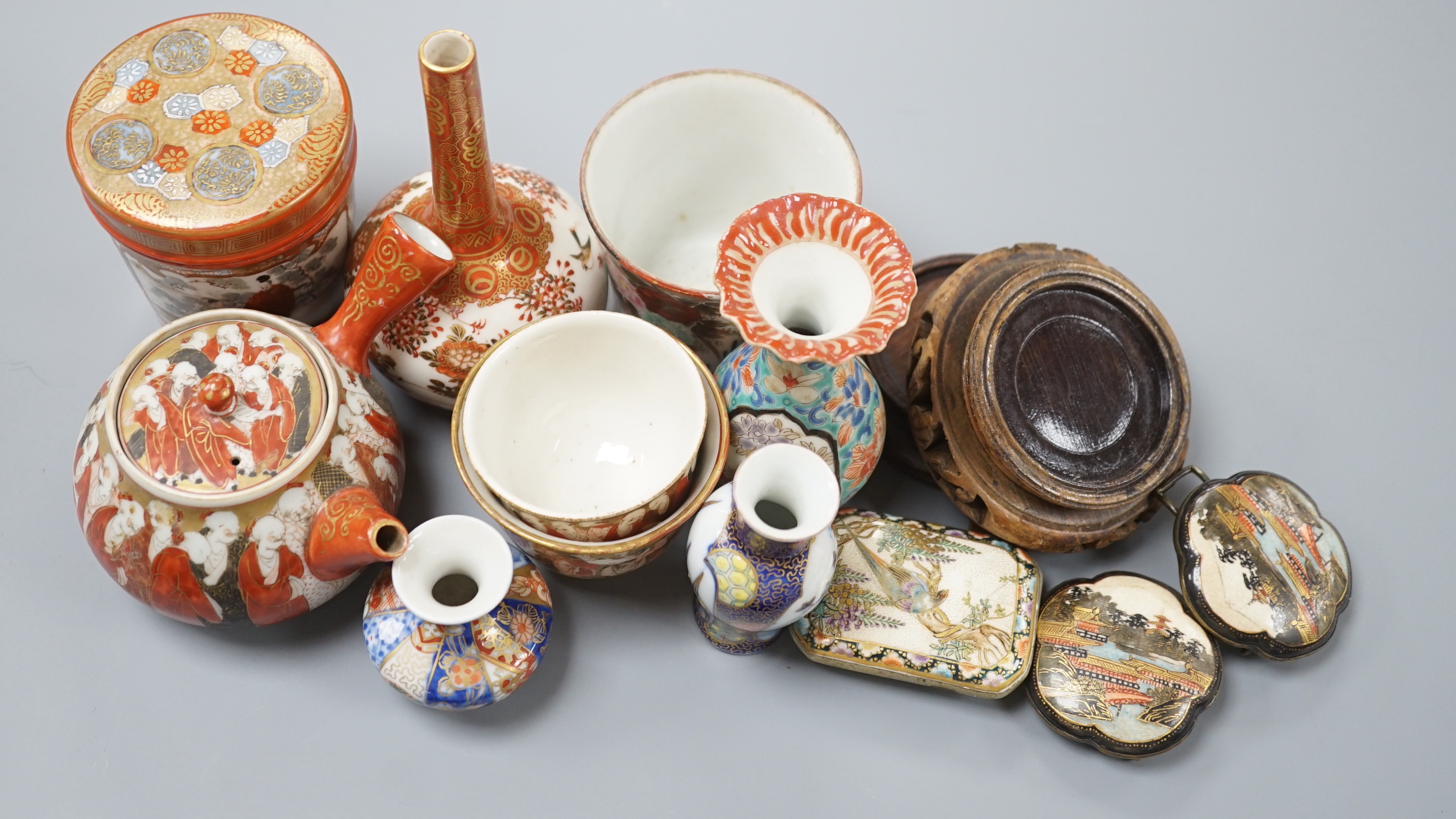 A group of Japanese small or miniature Kutani and Imari vessels and three Satsuma pottery mounted brooches, largest 11.7cm